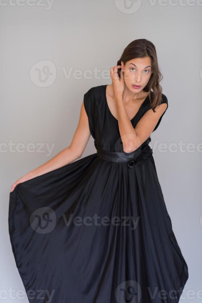 woman in a black dress isolated on white background photo