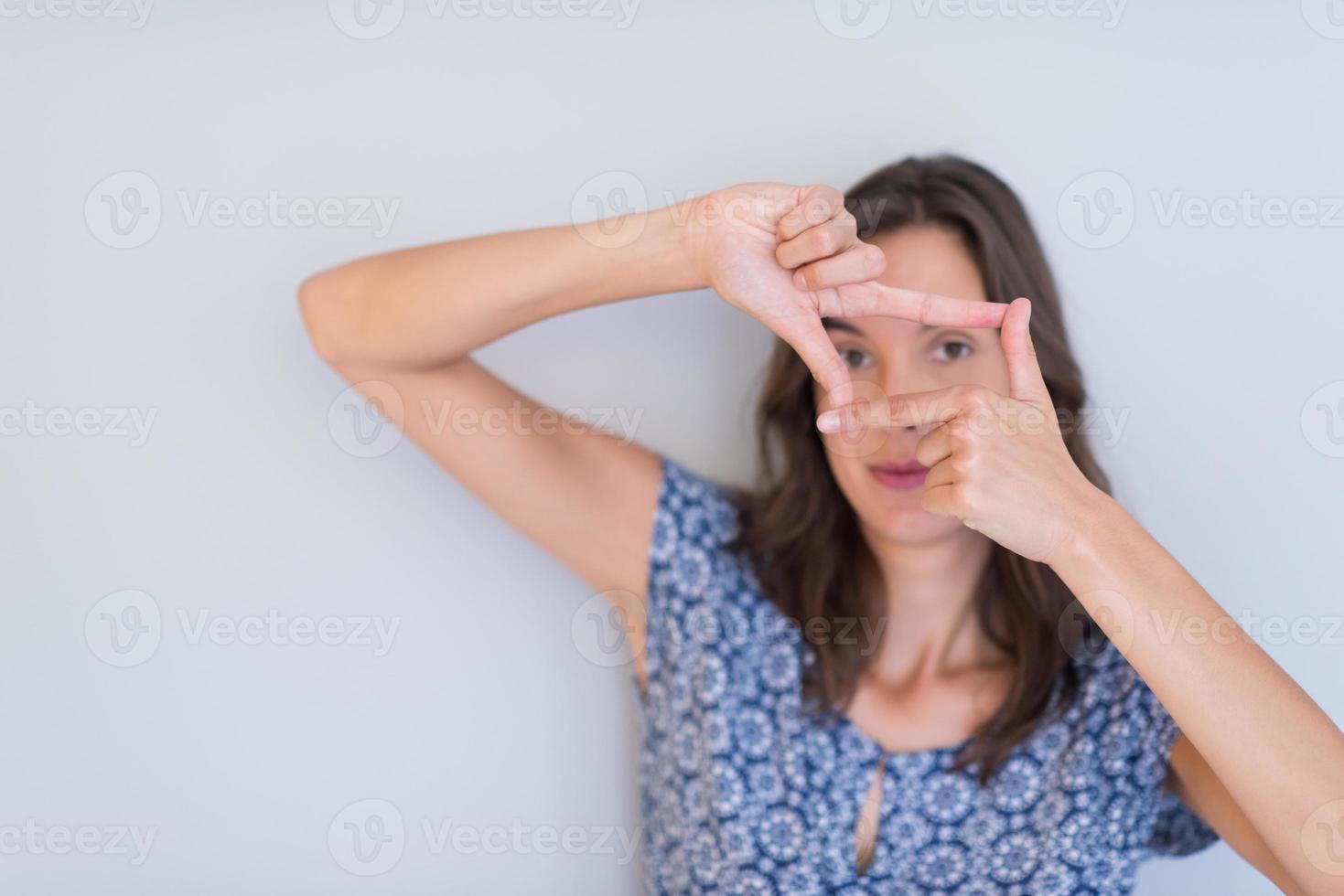 woman showing framing hand gesture photo