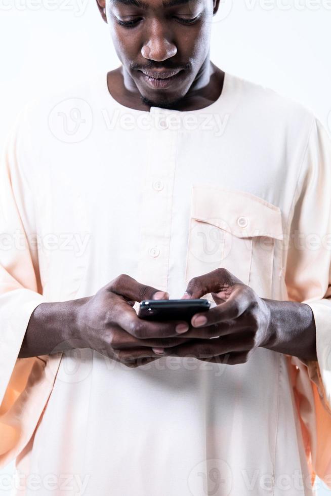 african man using smartphone photo