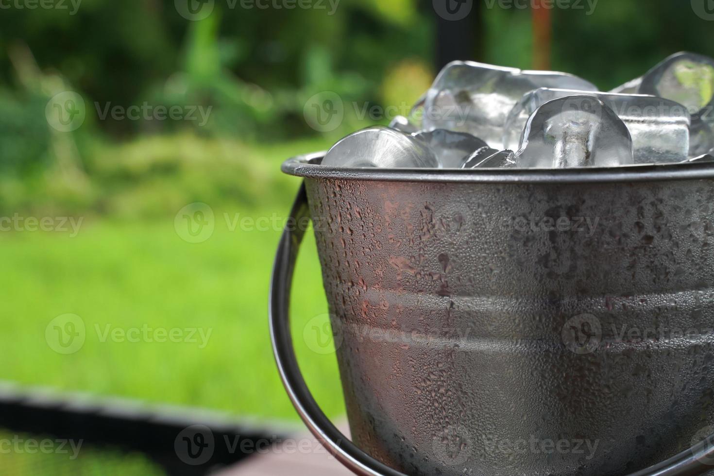 The ice is frozen in a stainless steel tank until it condenses into water droplets. photo