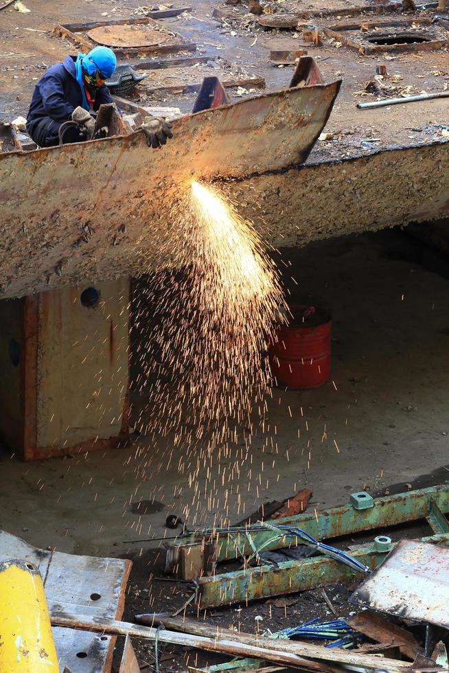 Workers are cutting steel photo