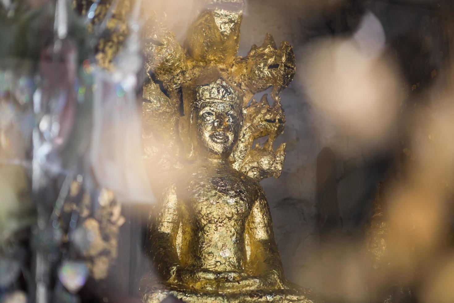 close up Buddha statue gilded in the measure photo