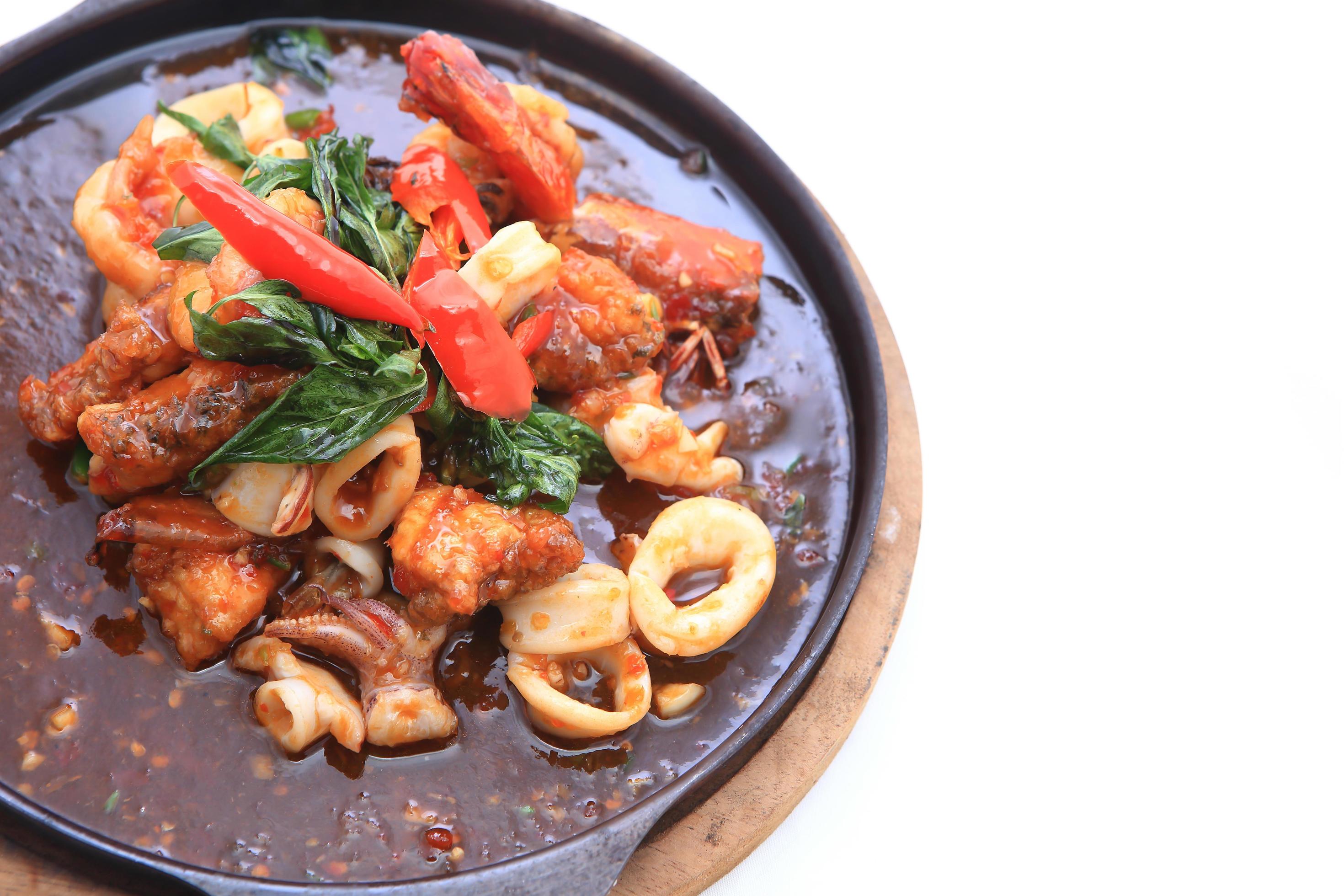 seafood stir fried with Thai herb. 10409188 Stock Photo at Vecteezy