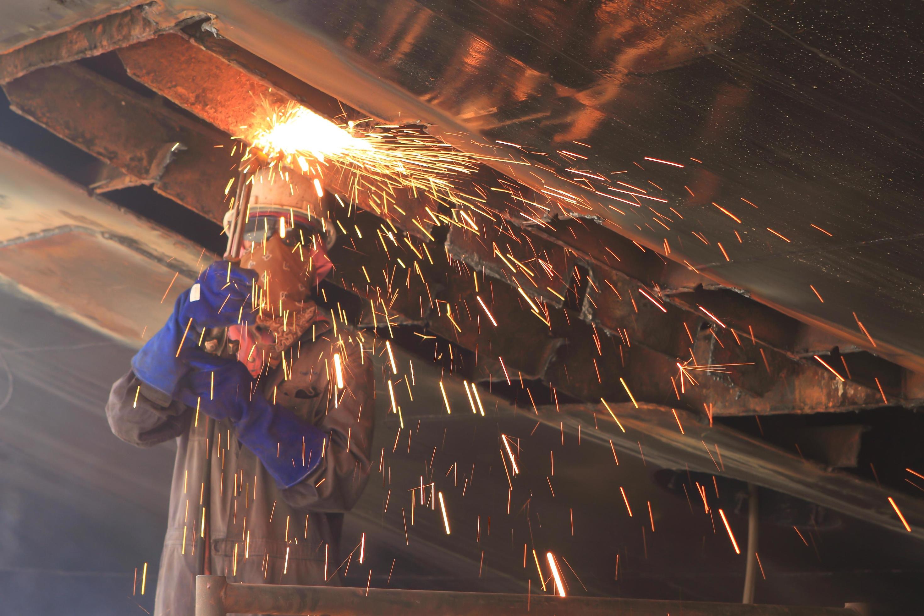 A Welder Working A Torch At Shipyard 10409534 Stock Photo At Vecteezy a-welder-working-a-torch-at-shipyard-10409534-stock-photo-at-vecteezy