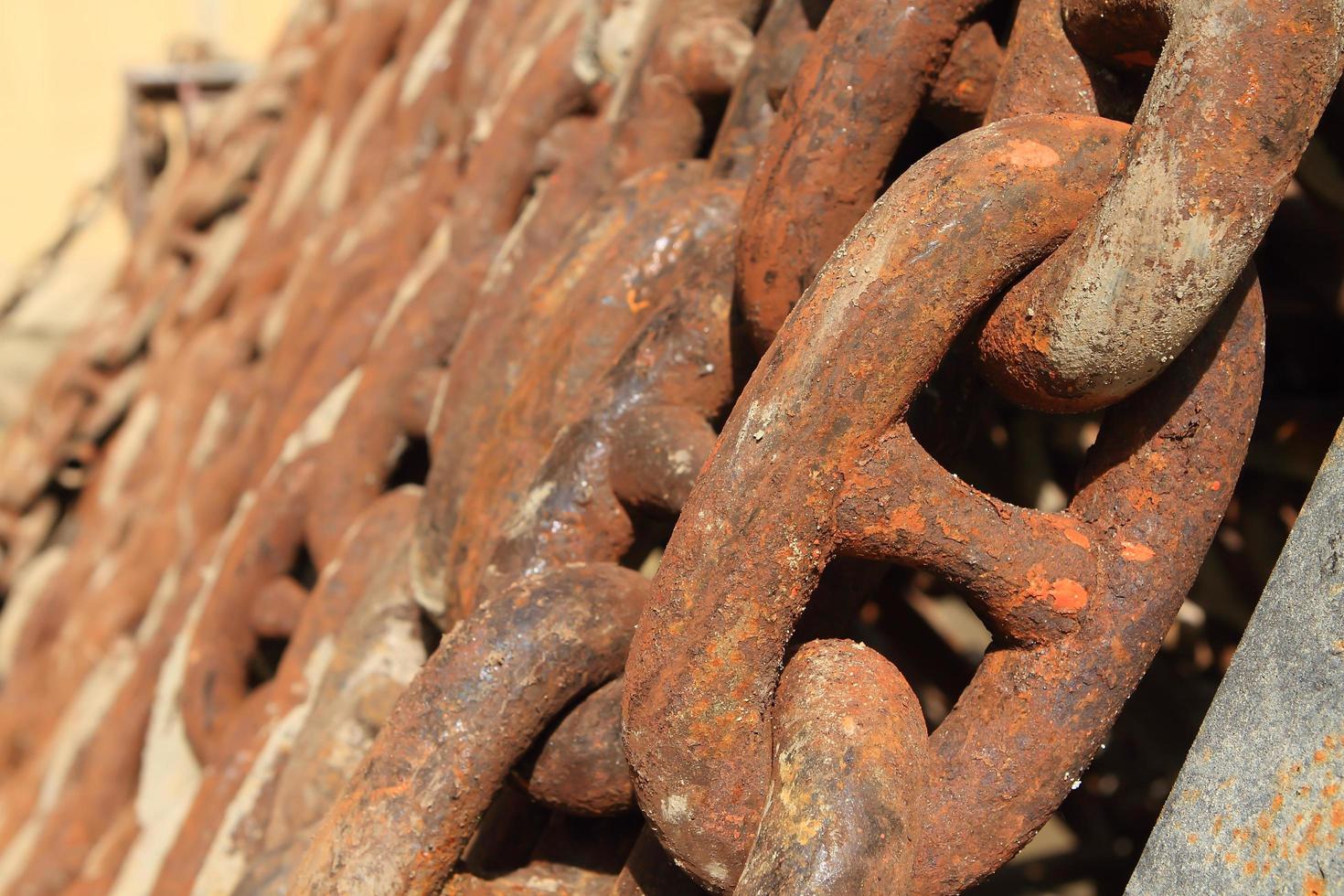 Old rusty ship anchor chain links close up. photo