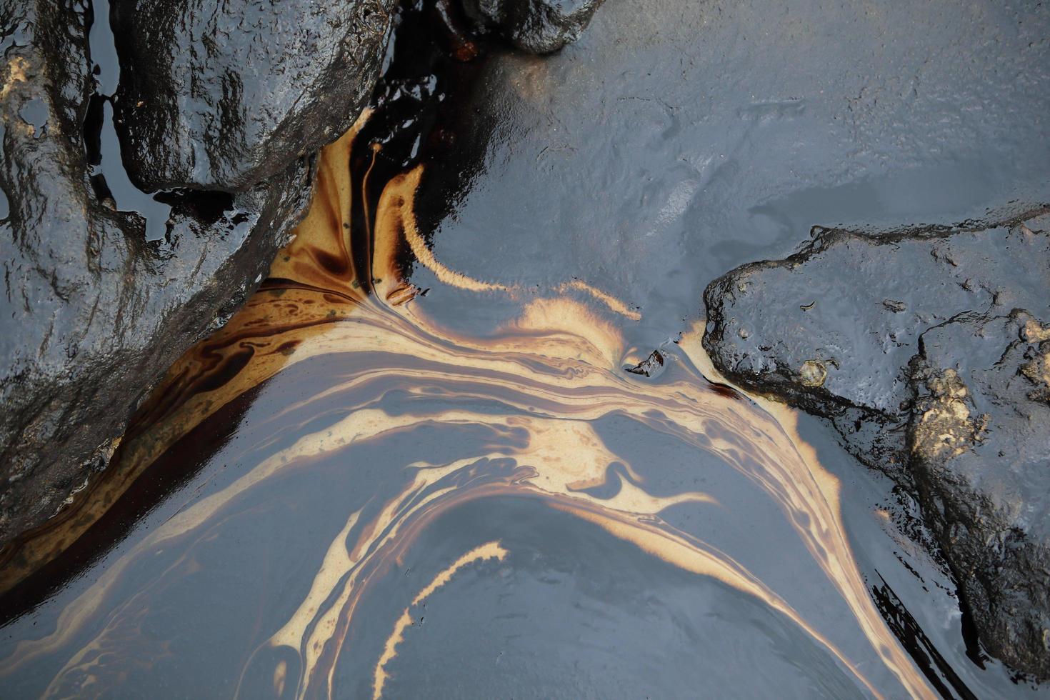 Gulf oil spill is shown on a beach photo