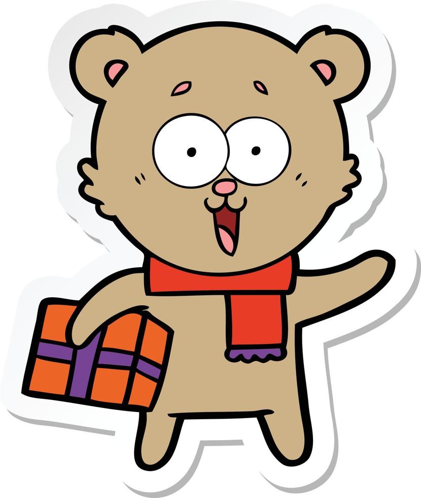 sticker of a laughing teddy  bear with christmas present vector