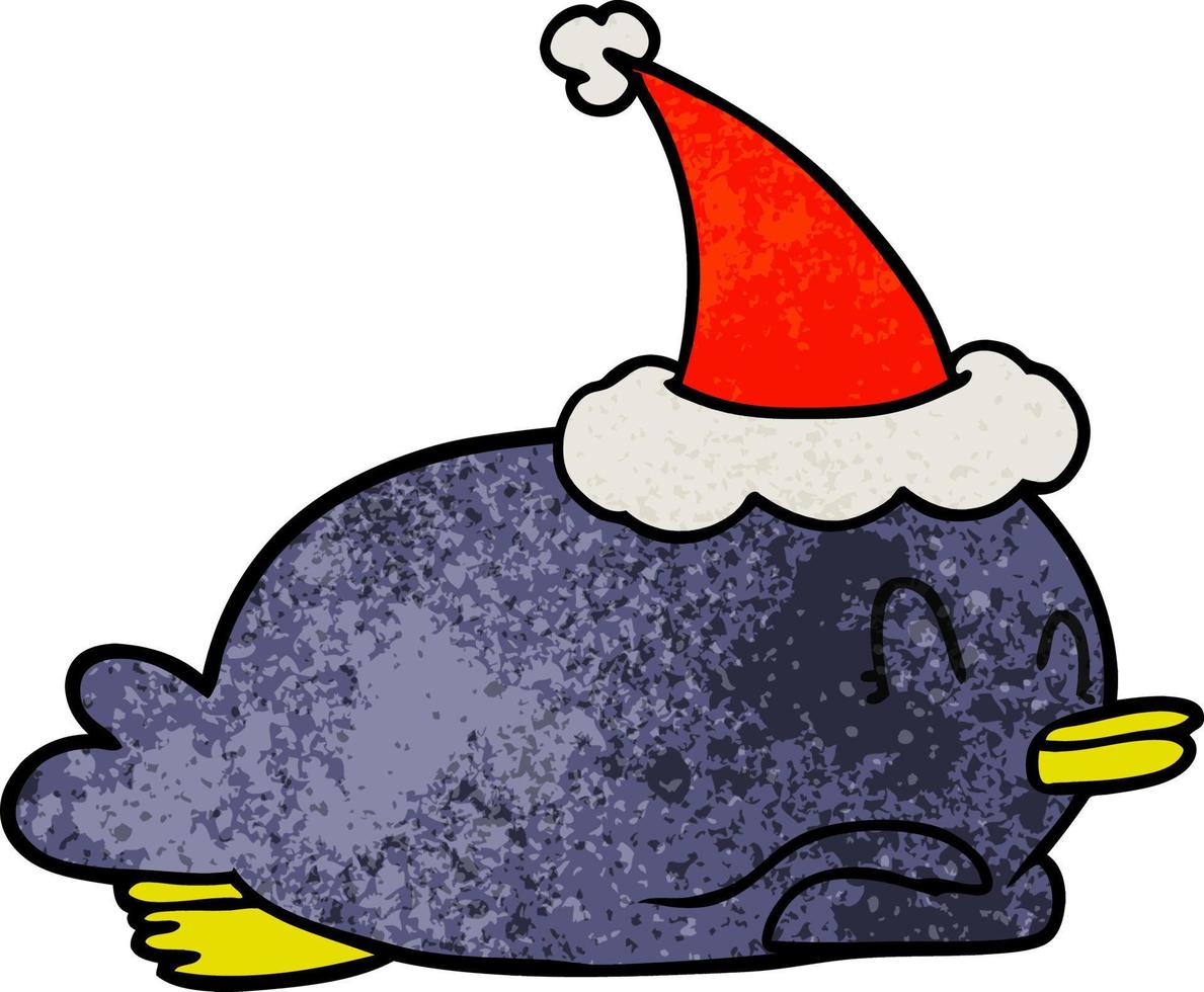 pingüino acostado boca abajo con gorro de Papá Noel vector