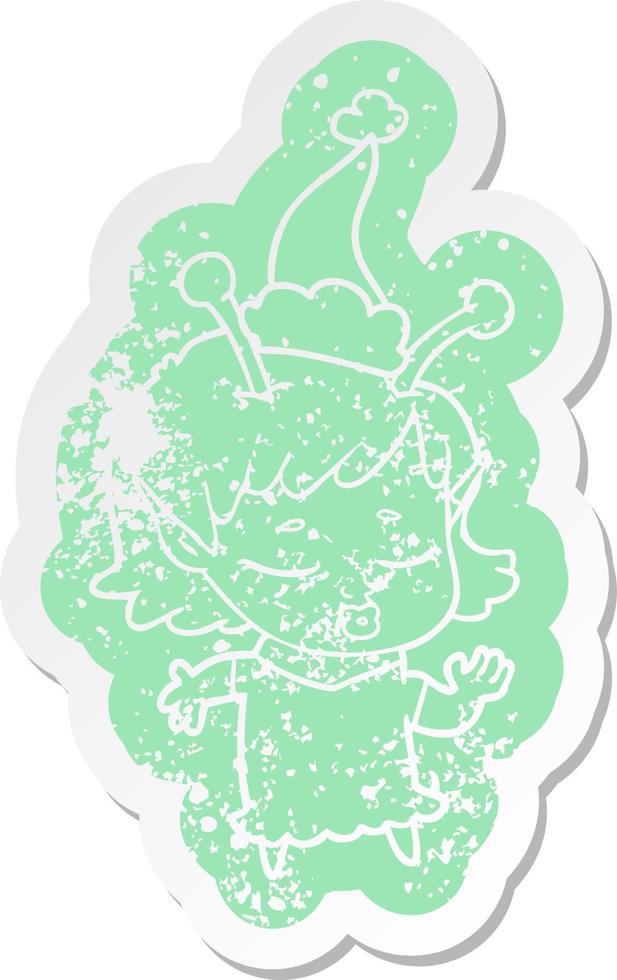 cute alien girl cartoon distressed sticker of a wearing santa hat vector