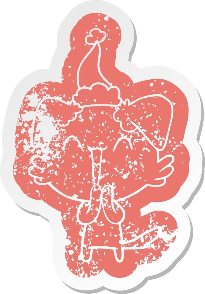 laughing little dog cartoon distressed sticker of a wearing santa hat vector