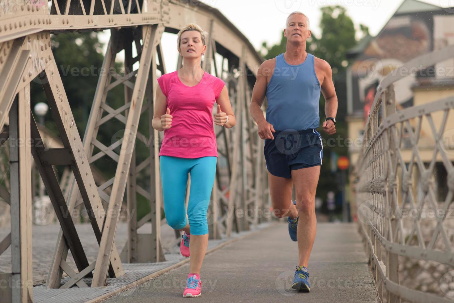 Couple jogging outside photo