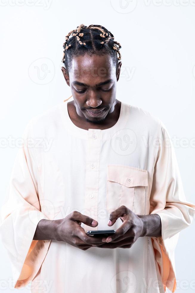 african man using smartphone photo
