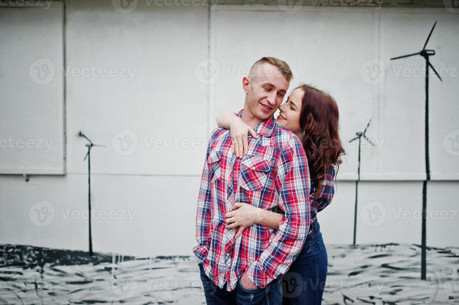 Stylish couple wear on checkered shirt in love together. photo