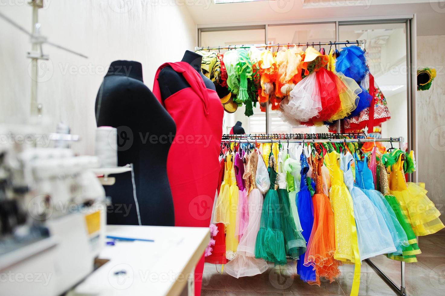 Children's carnival costumes at seamstress office. photo