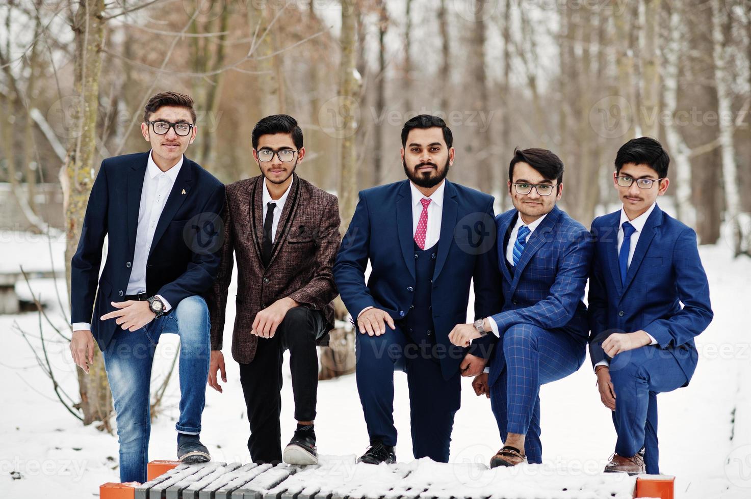 Group of five indian businessman in suits posed outdoor in winter day at Europe. photo