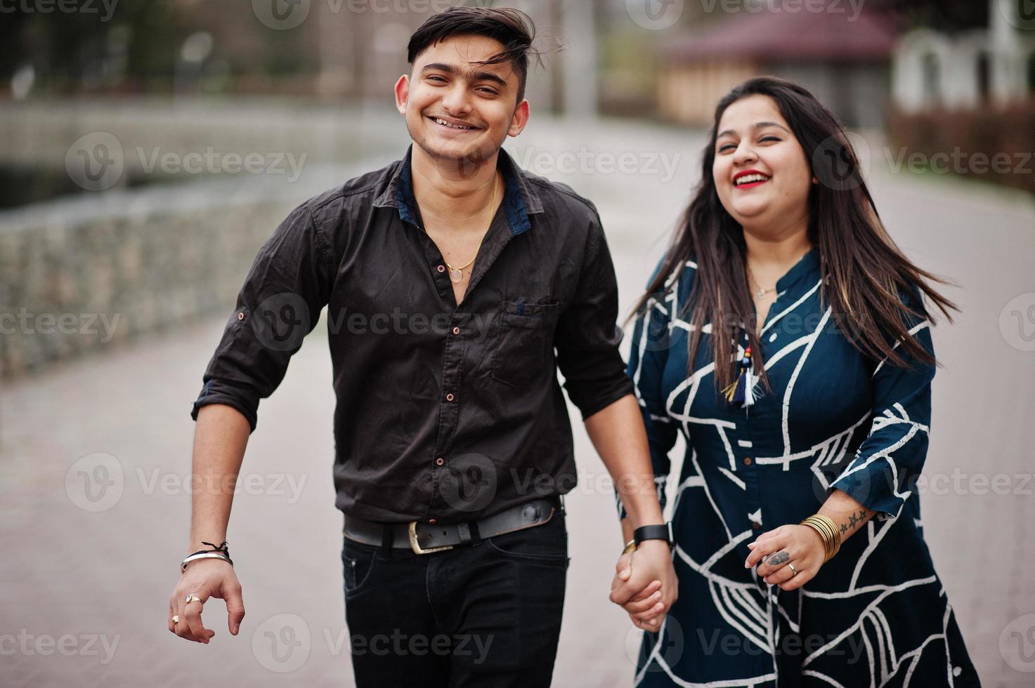 Love story of indian couple posed outdoor. photo