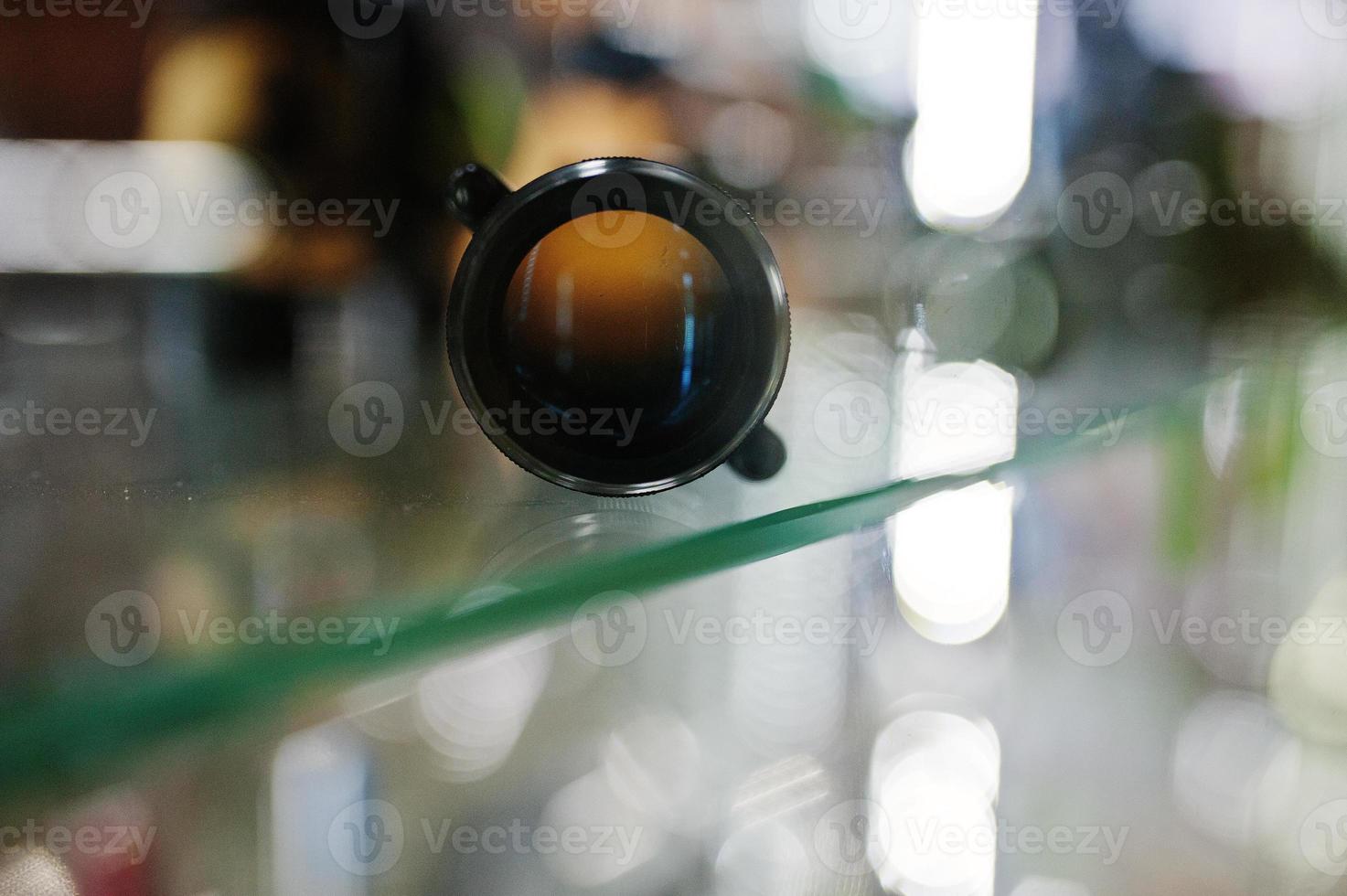 Optical sight on shelves store weapons on shop center. photo