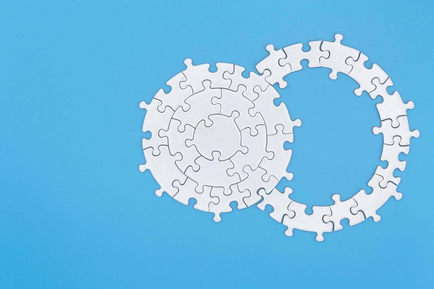 jigsaw puzzle pieces on blue background, Team business concept photo