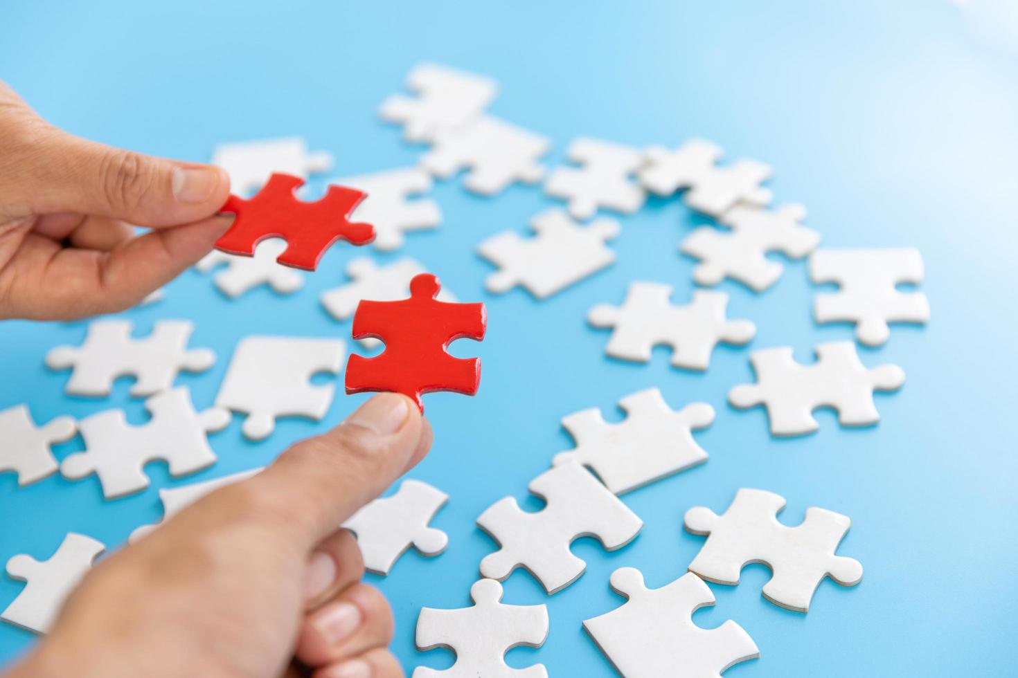 Hand of woman connecting jigsaw puzzle, Business solutions, success and strategy, Business partnership concept. photo