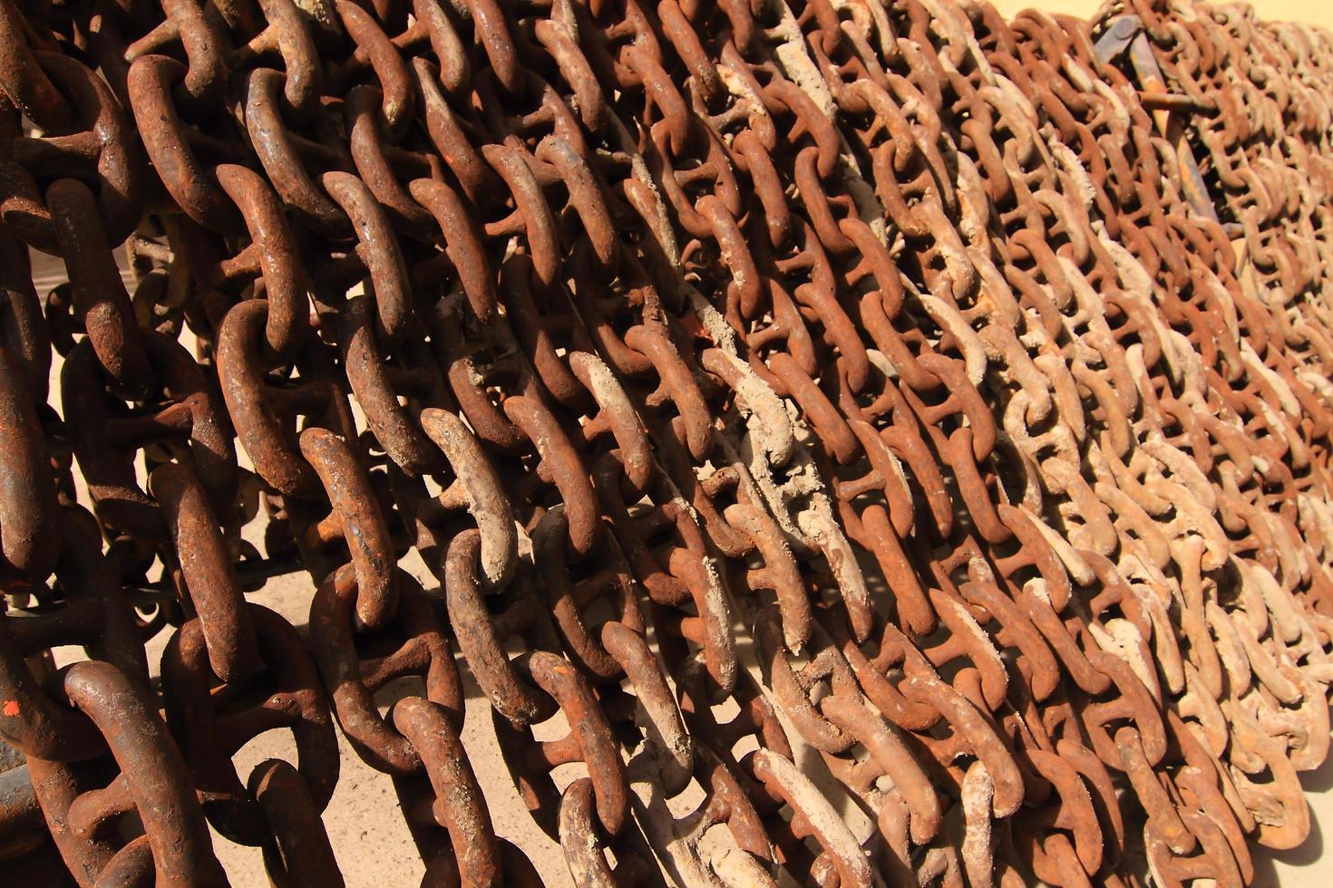 Old rusty ship anchor chain links close up. photo