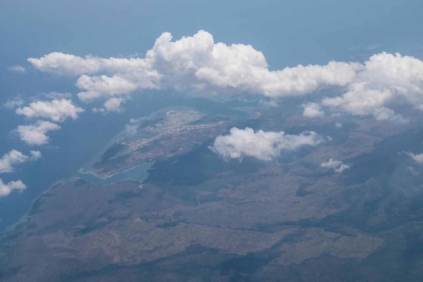 Bali island in tropical sea, veiw from airplane sight photo