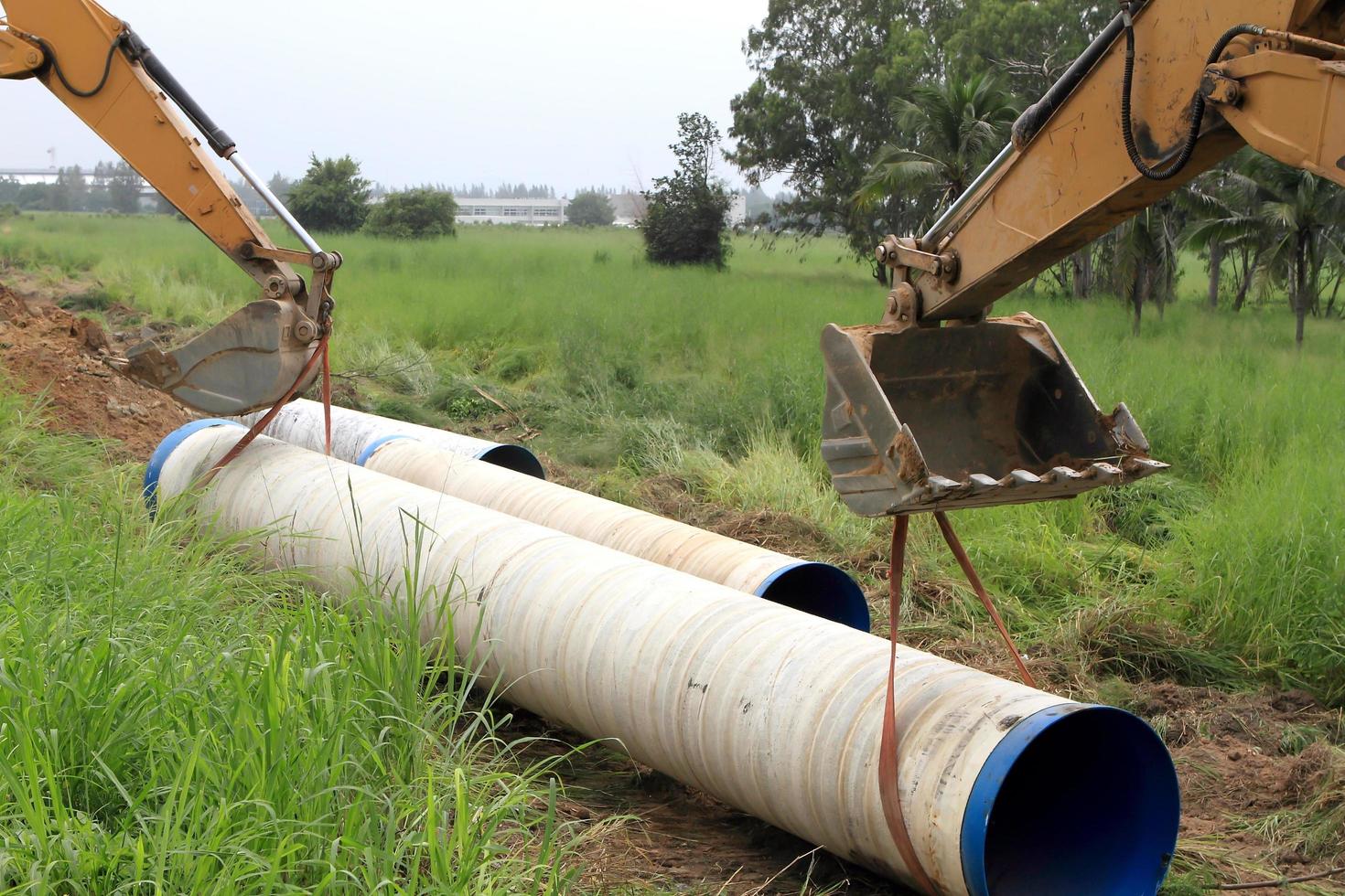 Specialized equipment for placing large diameter pipe in a trench photo