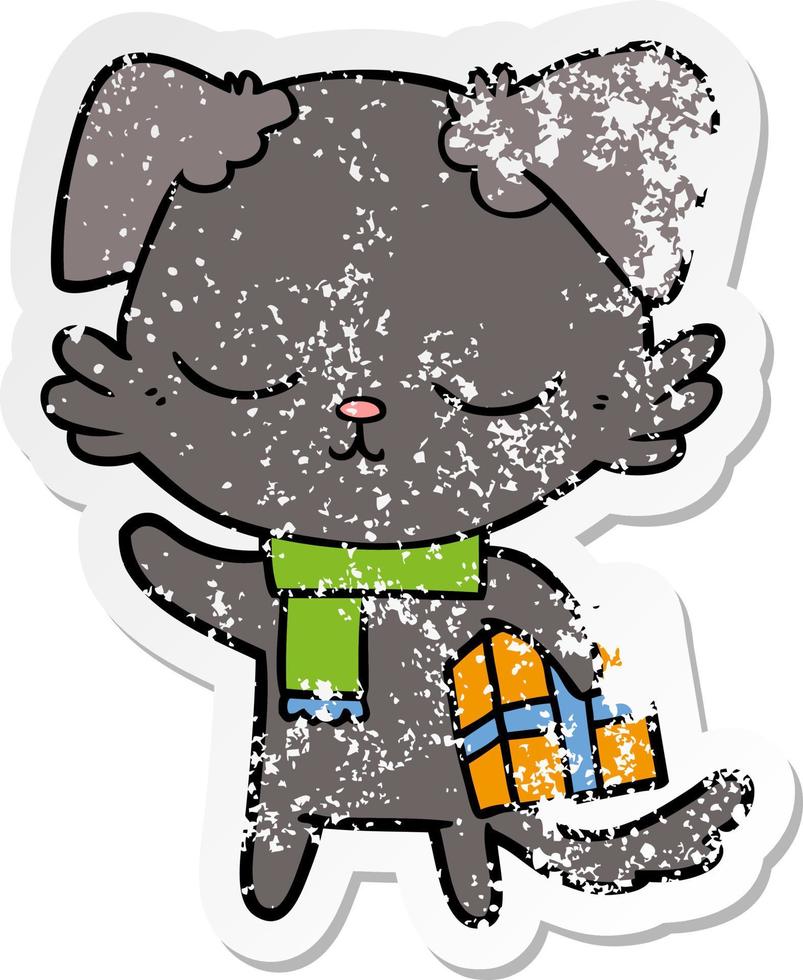 distressed sticker of a cute cartoon dog with christmas present vector