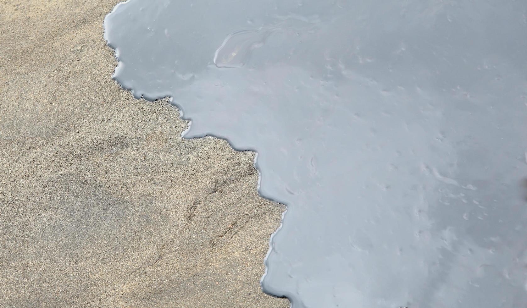 Gulf oil spill is shown on a beach photo