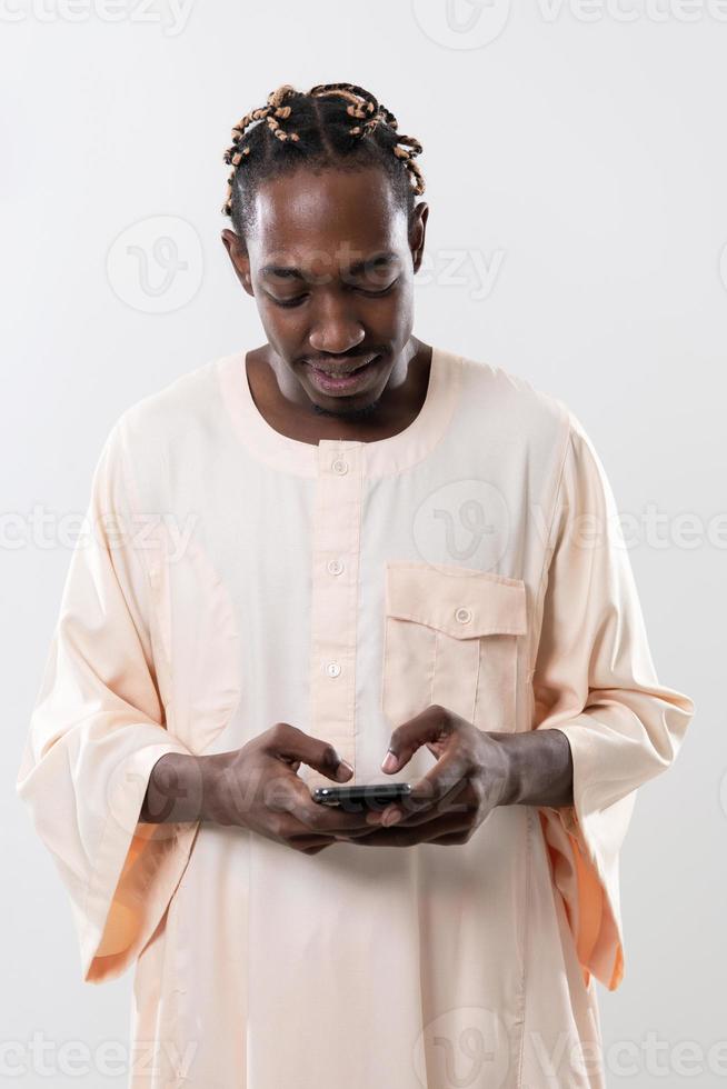 african man using smartphone photo