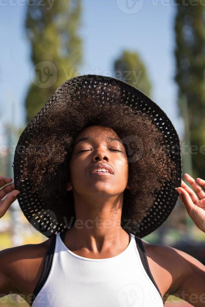 Close up portrait of a beautiful young african american woman smiling and looking up photo