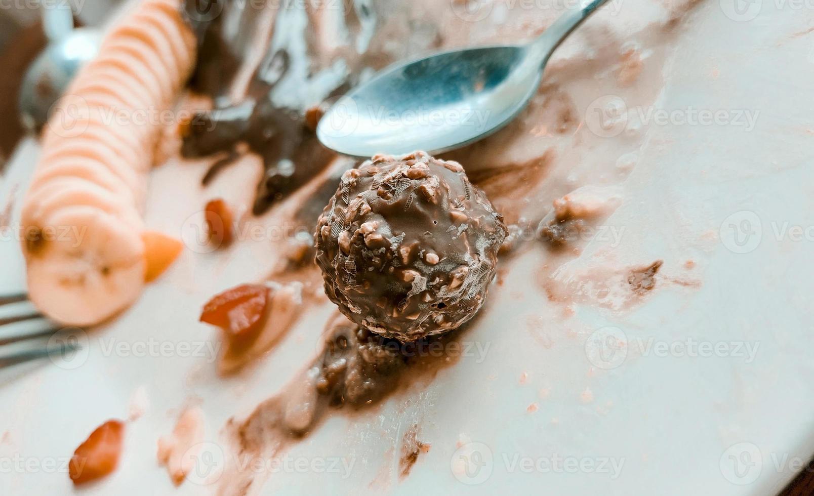 Choc ball and slices of banana. photo