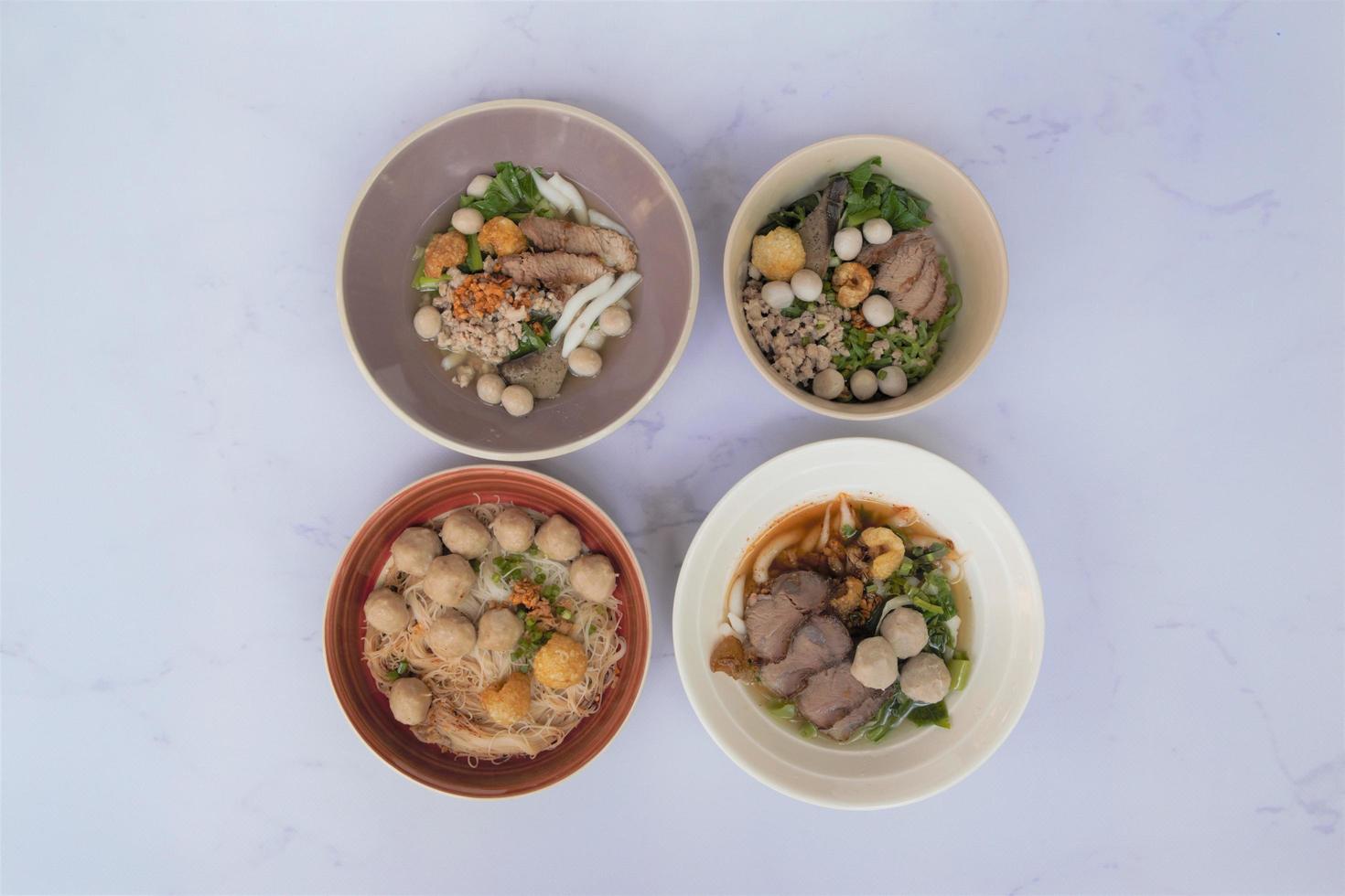 Overview of 4 bowls of noodles photo