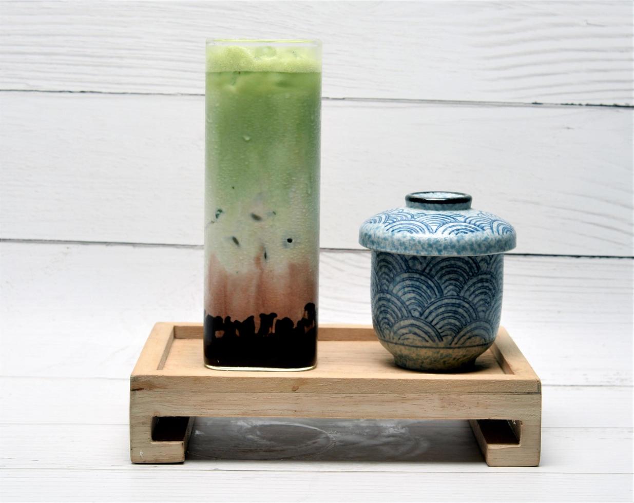 Green tea with milk and red bean photo