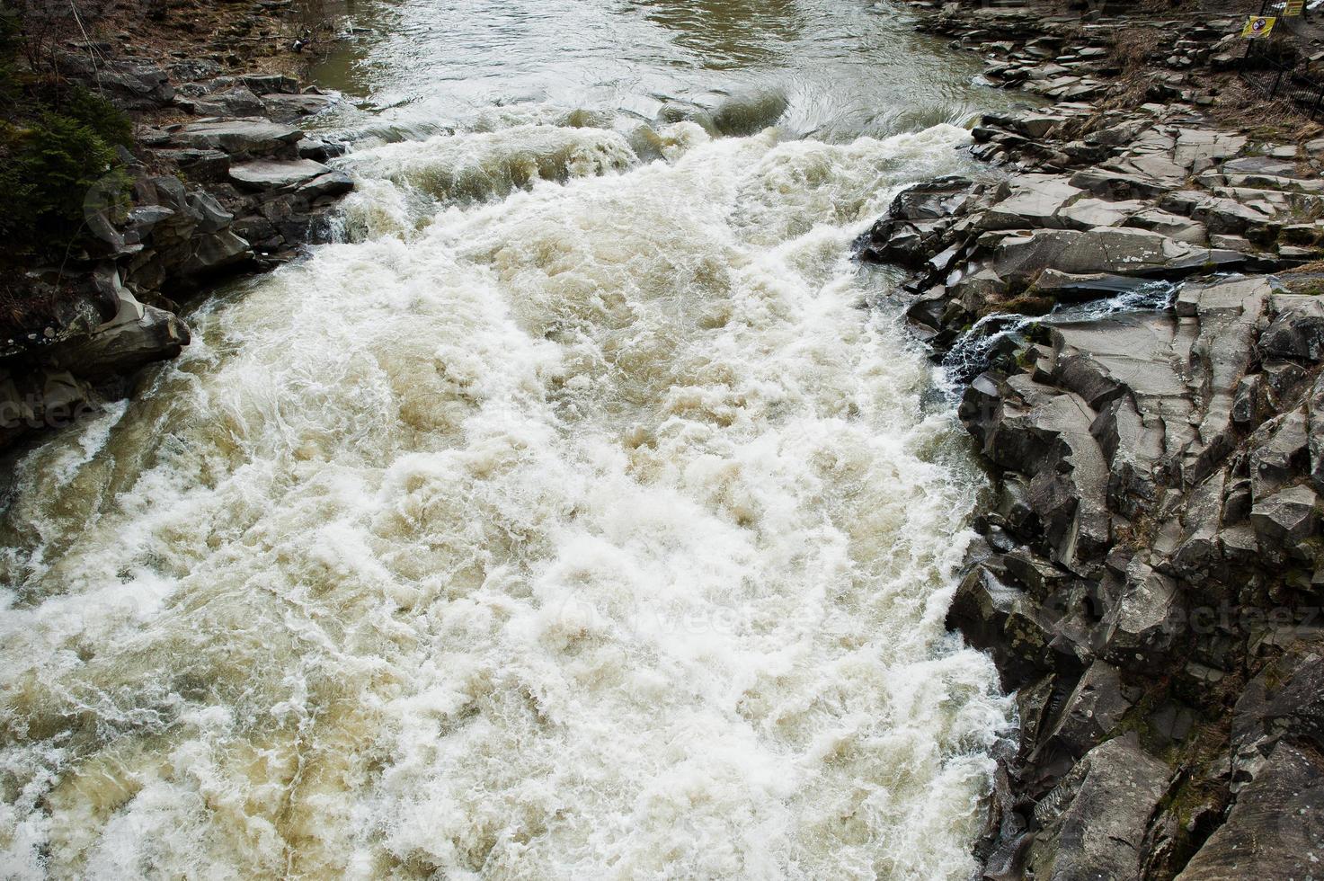 Incredible and stormy Prut river at Carpathian mountains, Jaremcze resort, Ukraine, Europe. photo