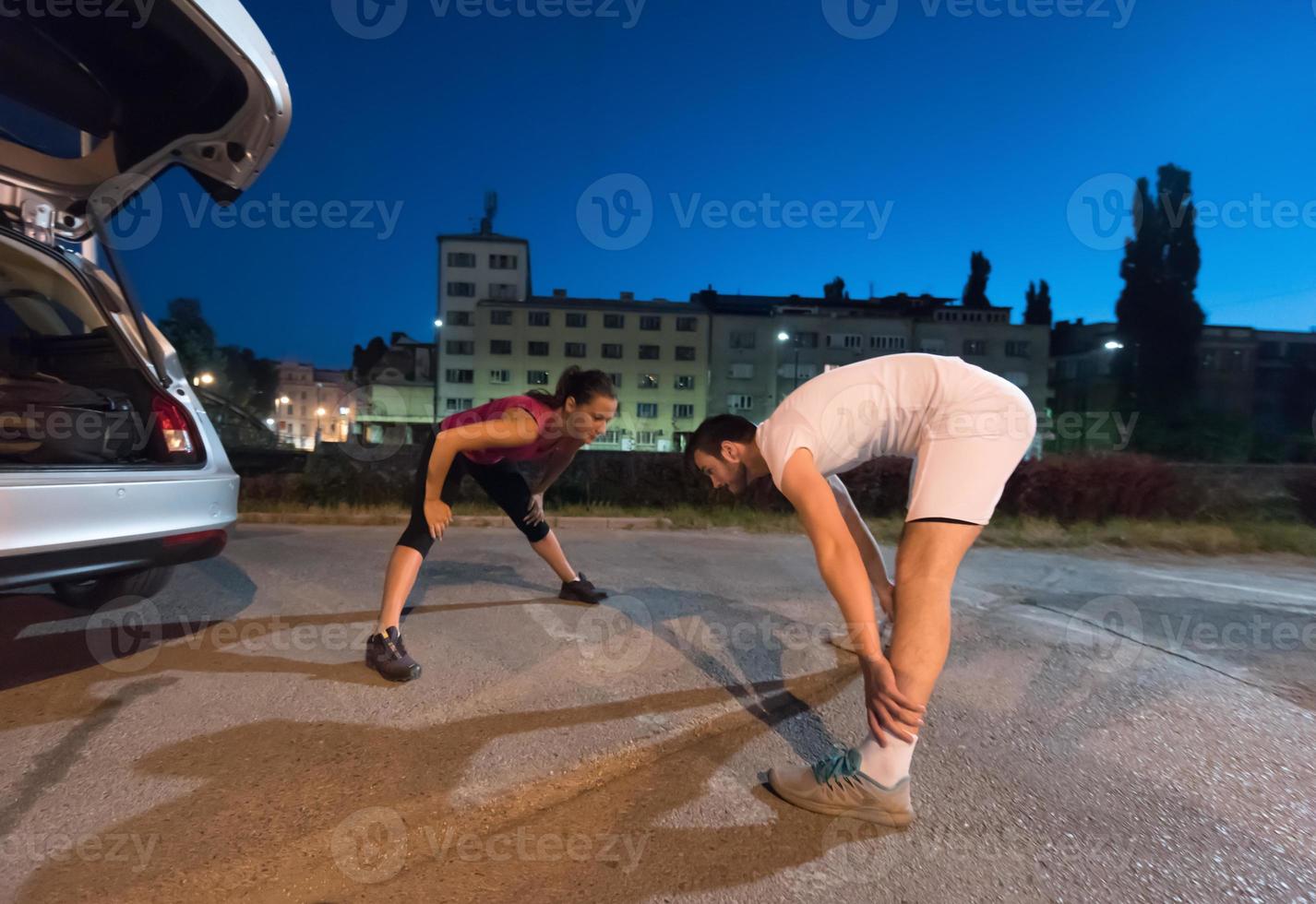 couple warming up and stretching photo