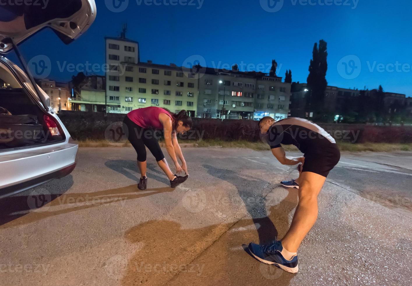 couple warming up and stretching photo