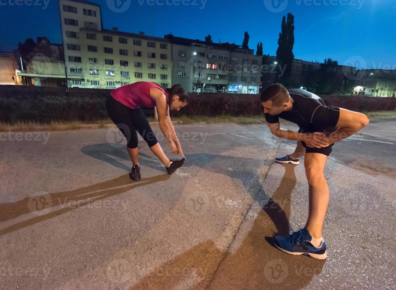 couple warming up and stretching photo
