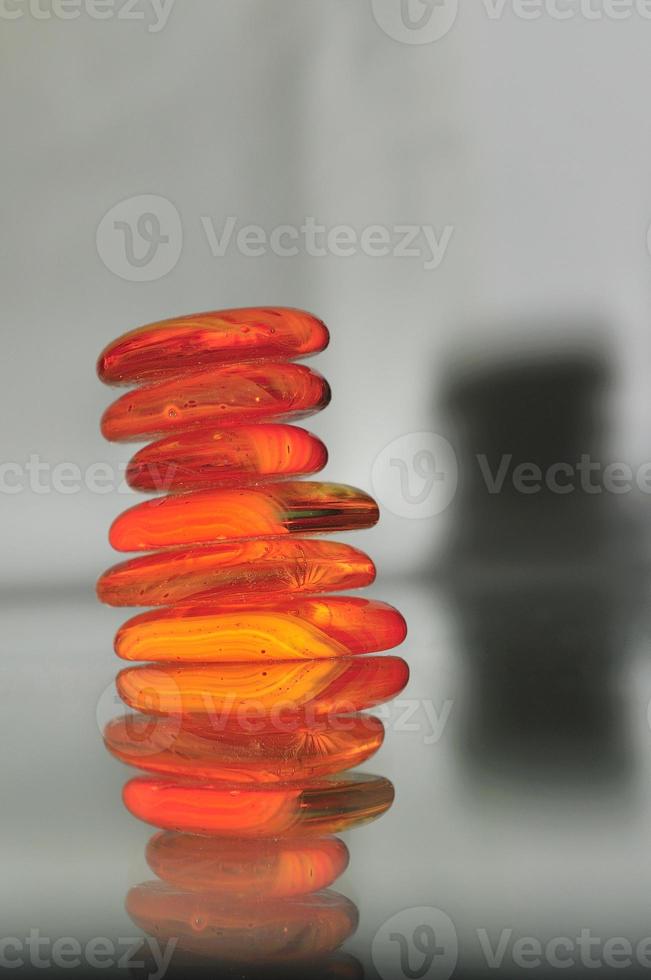 isolated wet zen stones with splashing  water drops photo