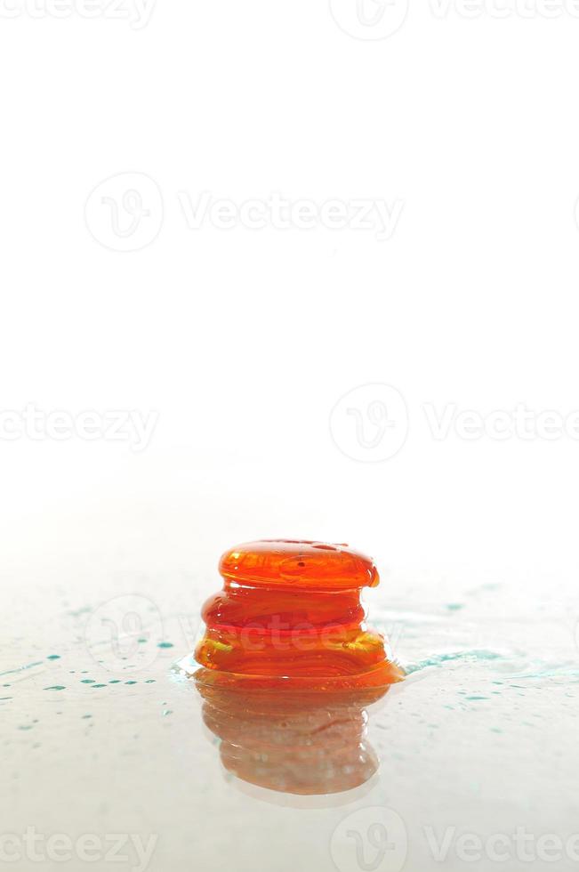 isolated wet zen stones with splashing  water drops photo