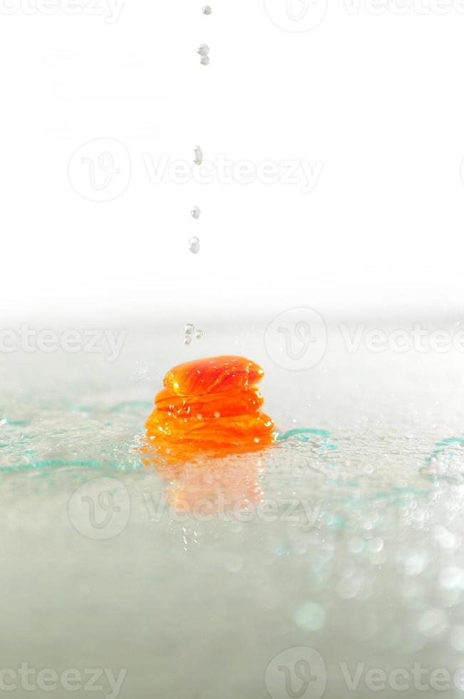isolated wet zen stones with splashing  water drops photo