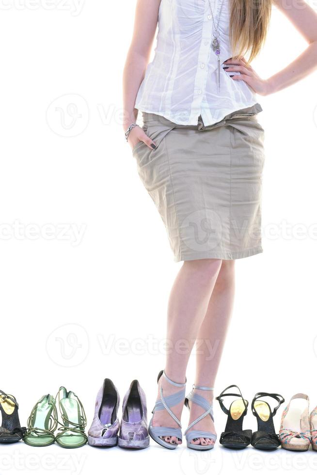 pretty young woman with buying shoes addiction, isolated on white background photo