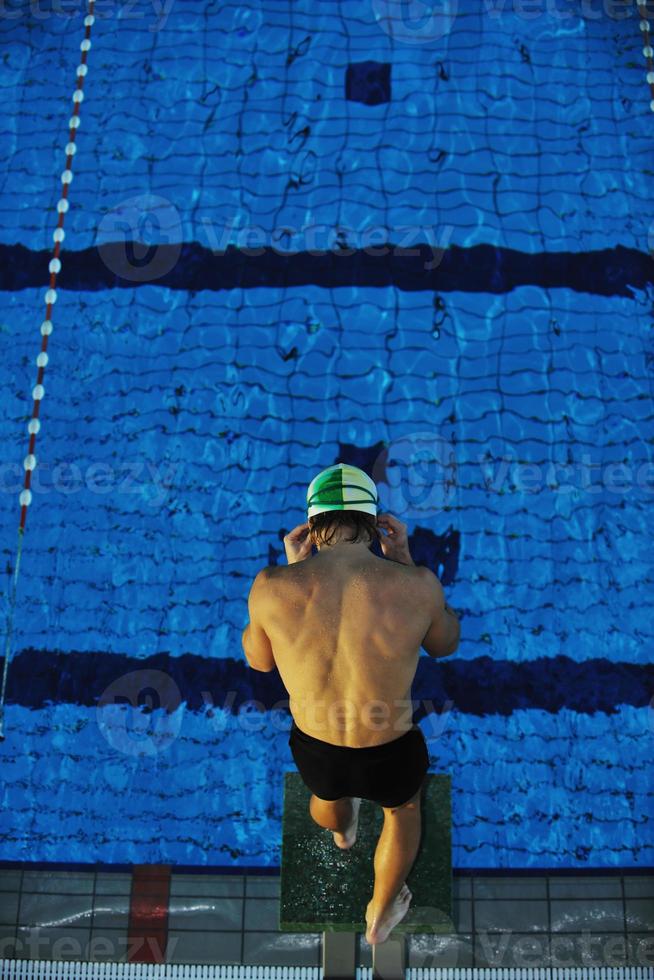 young swimmmer on swimming start photo