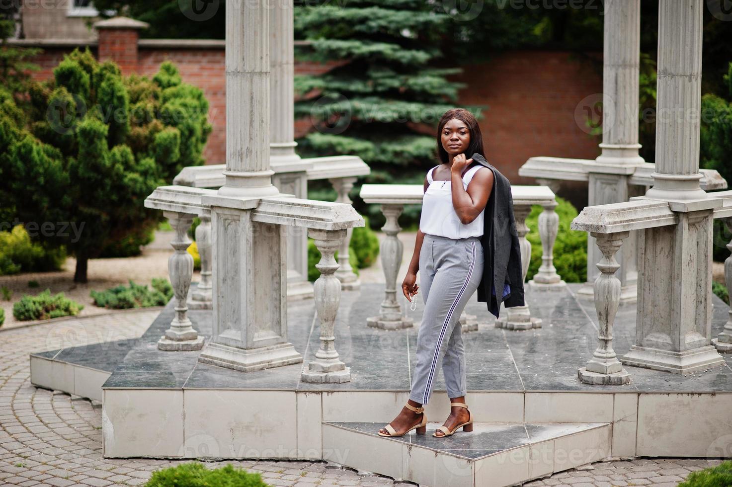 African american woman outdoor with rosary on hand. Concept for Faith, Spirituality and Religion. photo