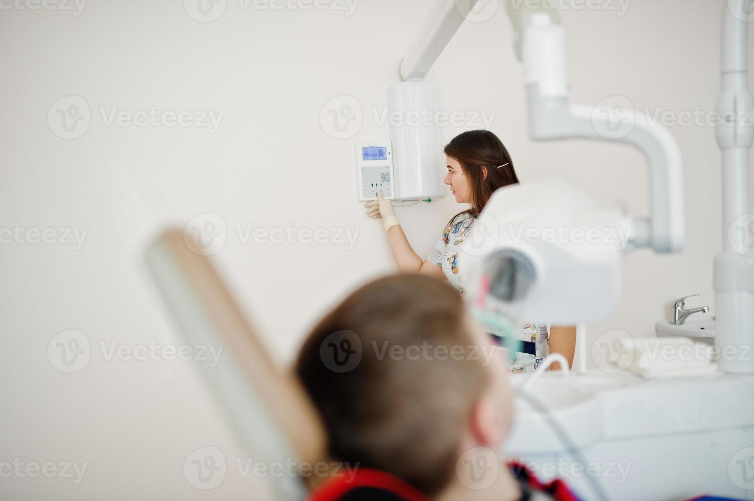 Little boy at dentist chair. Children dental. photo