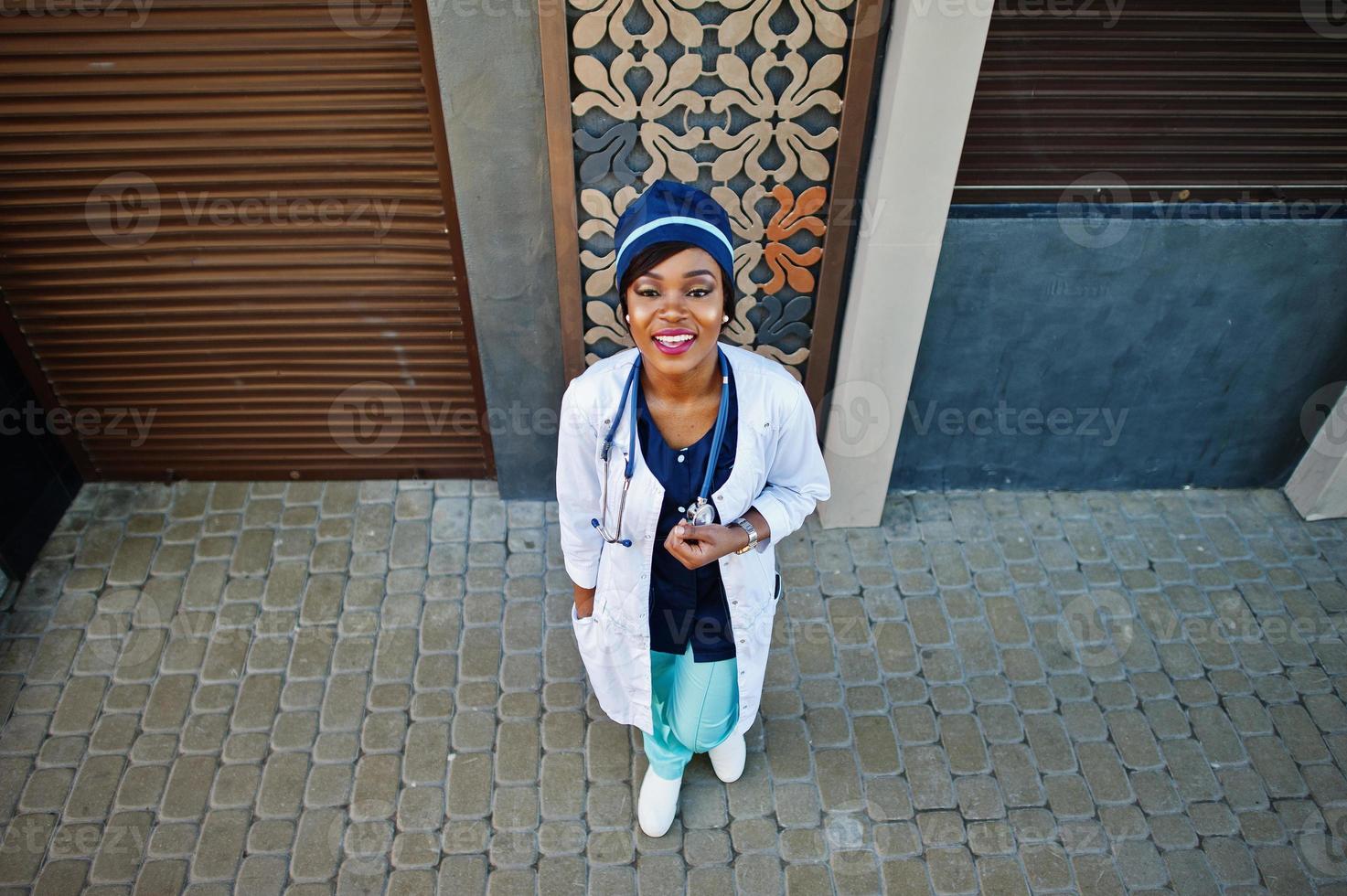 African american doctor female with stethoscope posed outdoor. photo