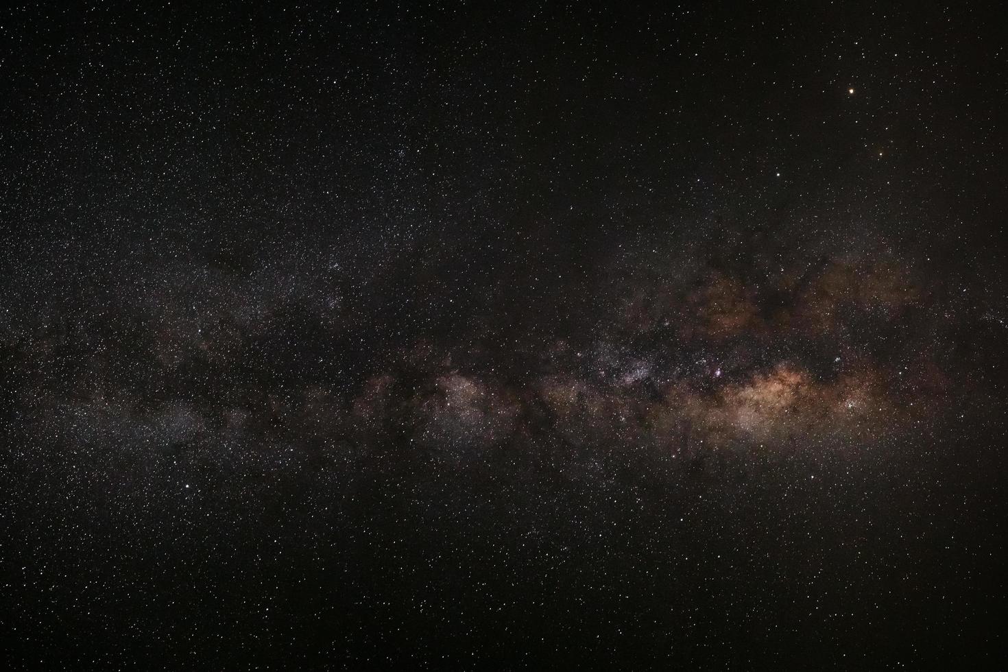 Milky way galaxy with stars and space dust in the universe, Long exposure photograph, with grain. photo