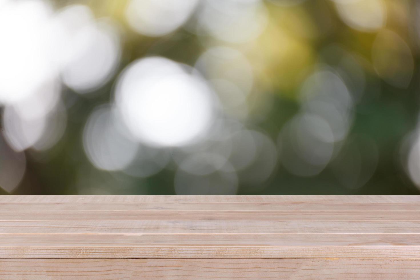 Wood table top on bokeh green background - can be used for montage or display your products photo