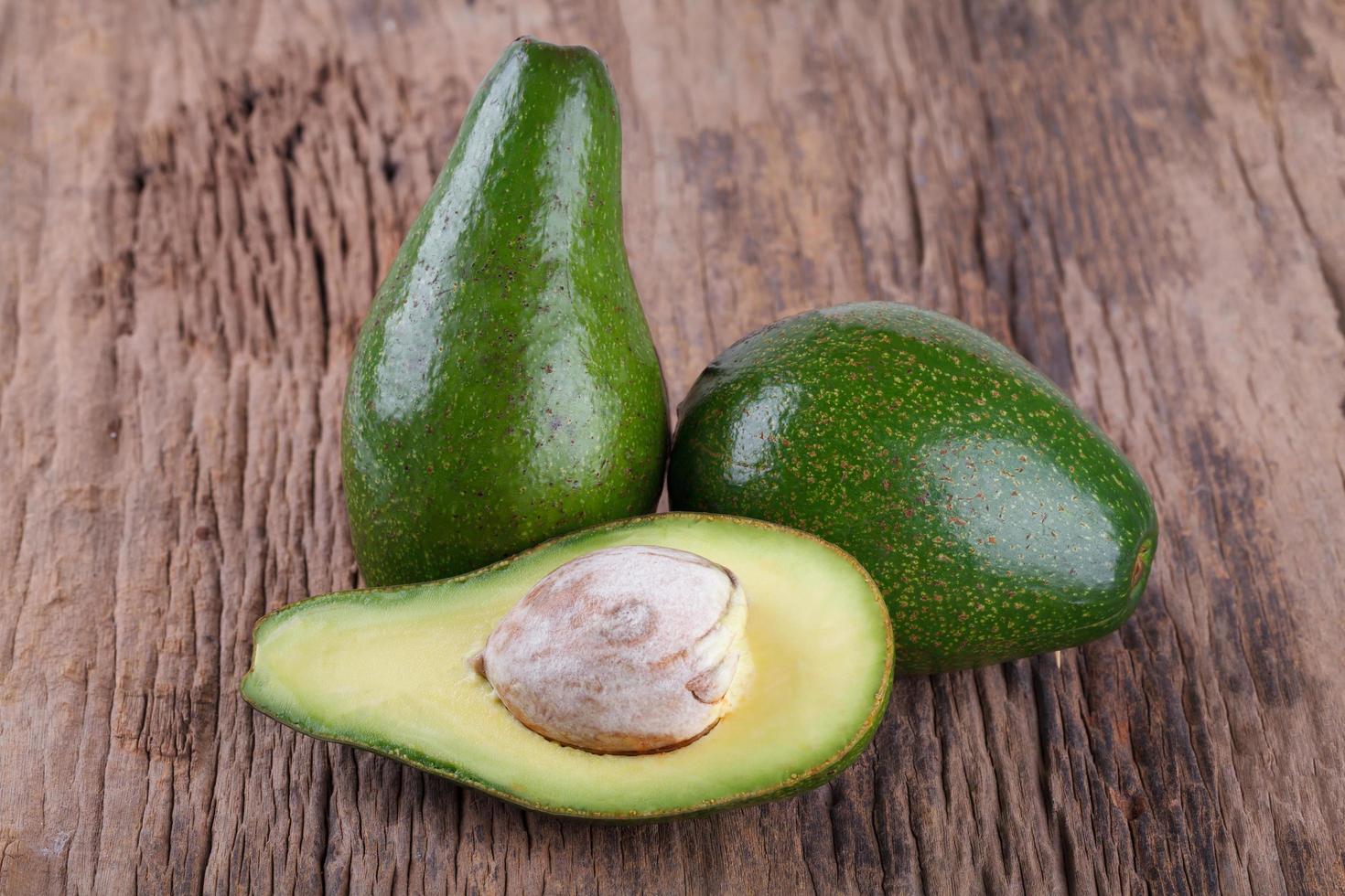 Avocado on a wooden background photo