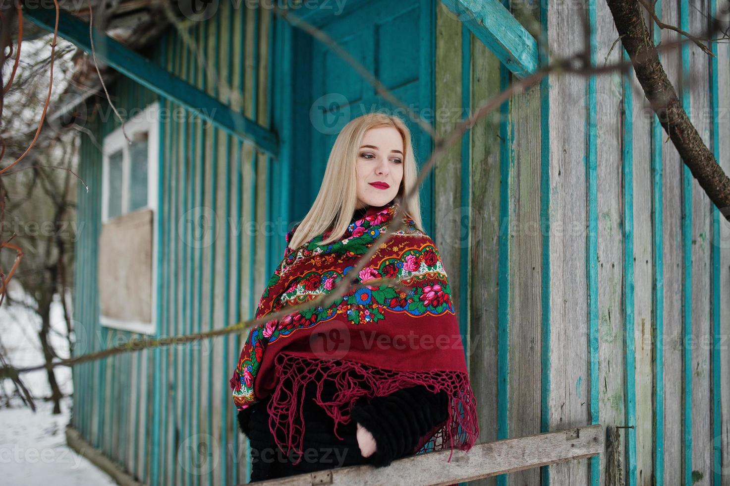 Blonde girl with hand embroidered scarf posed at winter day. Women's handkerchief. photo