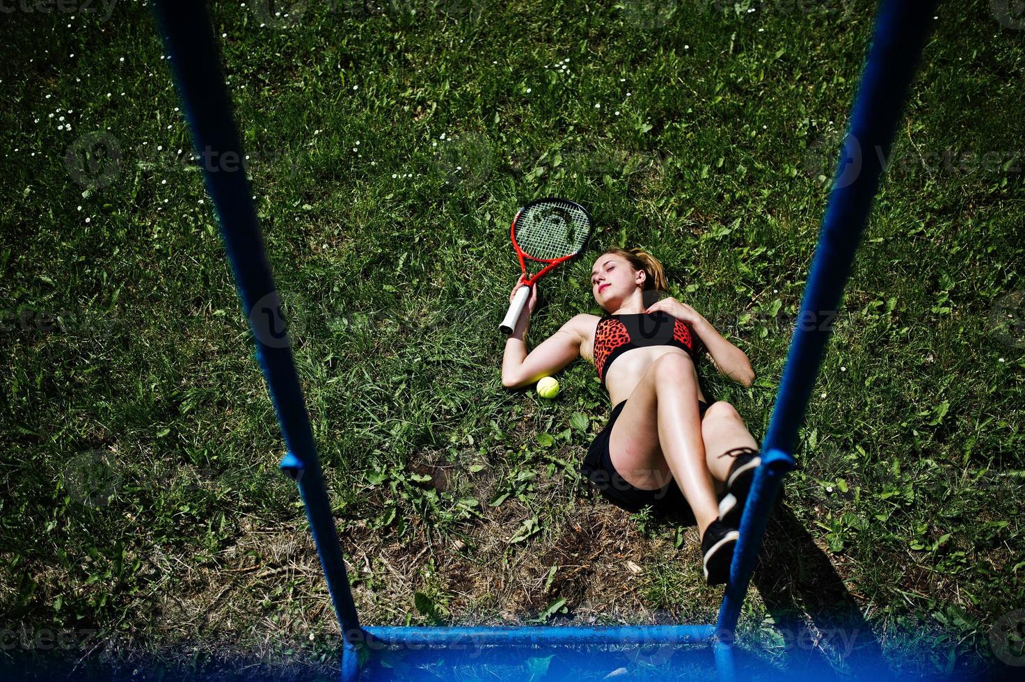 Beautiful sport woman tennis player with racket in sportswear costume. photo